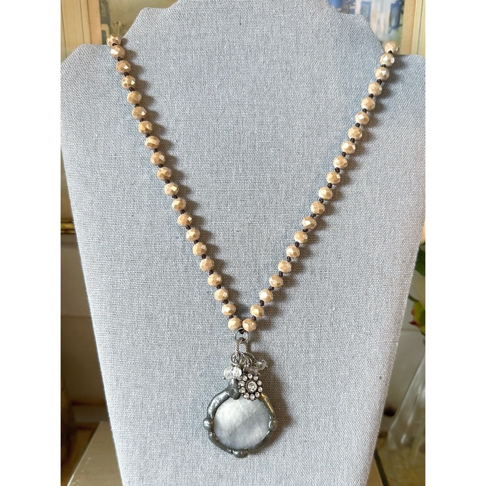 Long necklace beige faceted crystal beads & large silver-toned medallion pendant